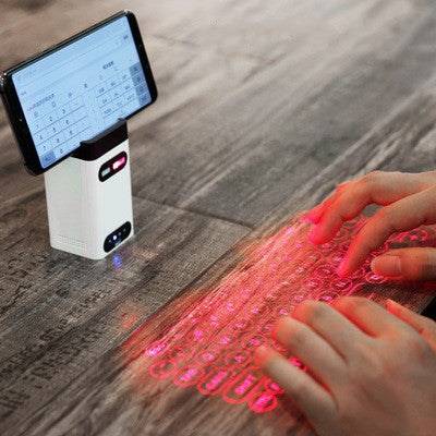 LEING FST Virtual Laser Keyboard projects a wireless keyboard with mouse function onto any flat surface for typing anywhere.
